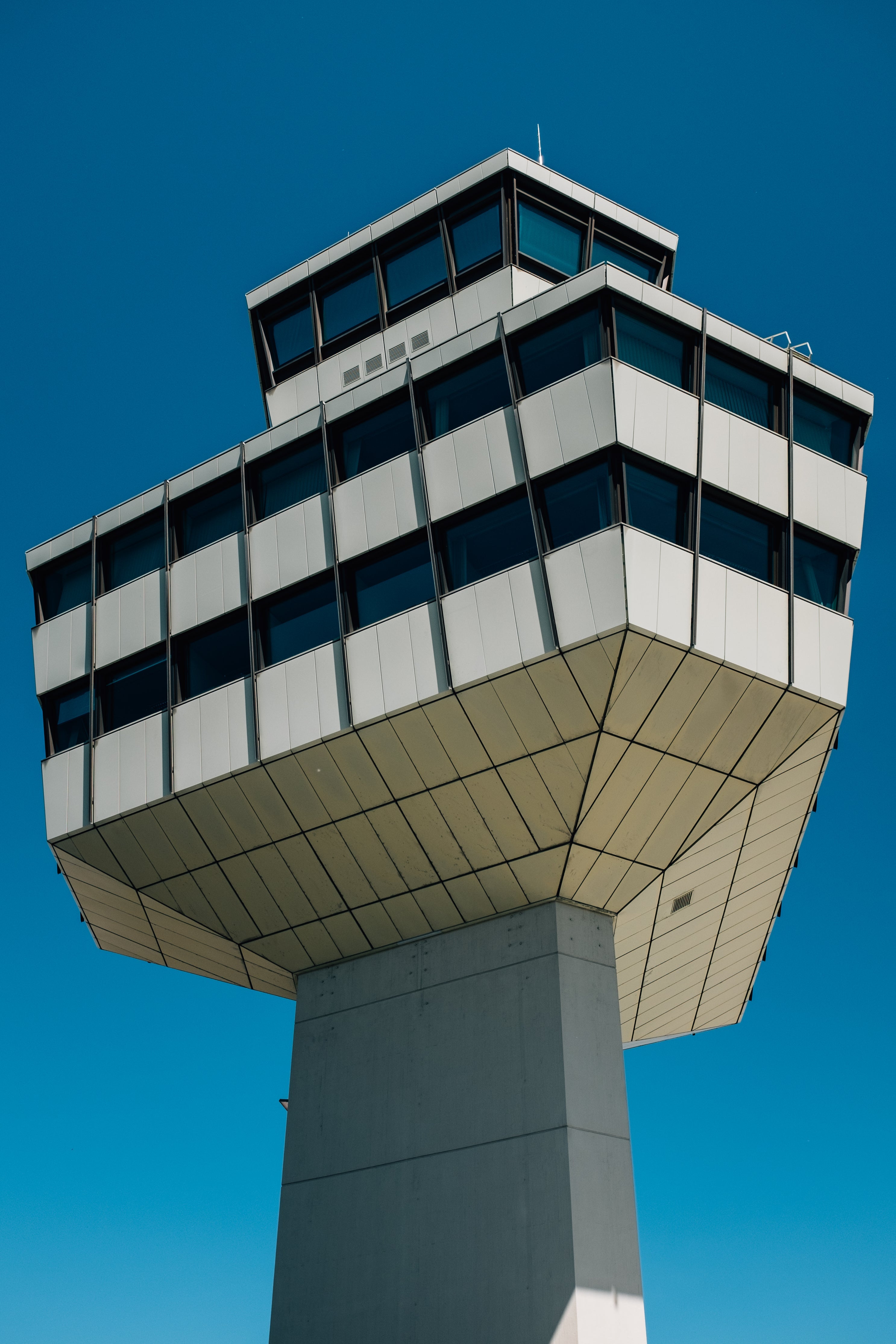 Control tower against a clear blue sky